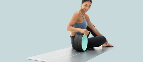 A woman using the Chirp Wheel while sitting down